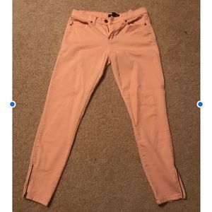 Peach denim pants.